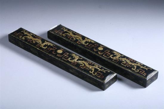 Appraisal: PAIR CHINESE BLACK LACQUER AND GILT DRAGON PAPER WEIGHT Each