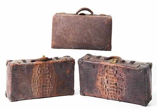 Appraisal: Elephant and alligator suitcases late th early th century comprising