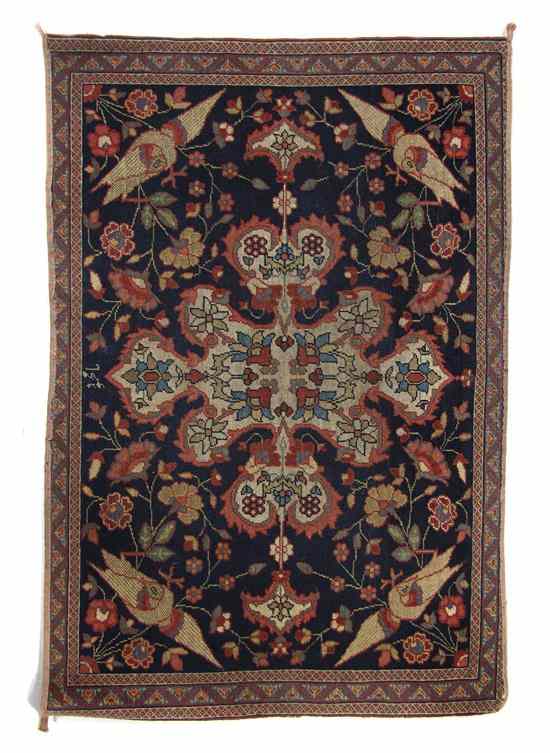 Appraisal: A Persian Wool Mat having a stylized foliate center medallion