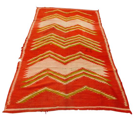 Appraisal: TRIBAL Navajo transitional eye dazzler blanket c red ground with