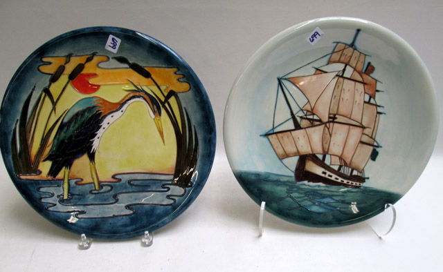 Appraisal: TWO MOORCROFT POTTERY CHARGERS the first hand painted under glaze