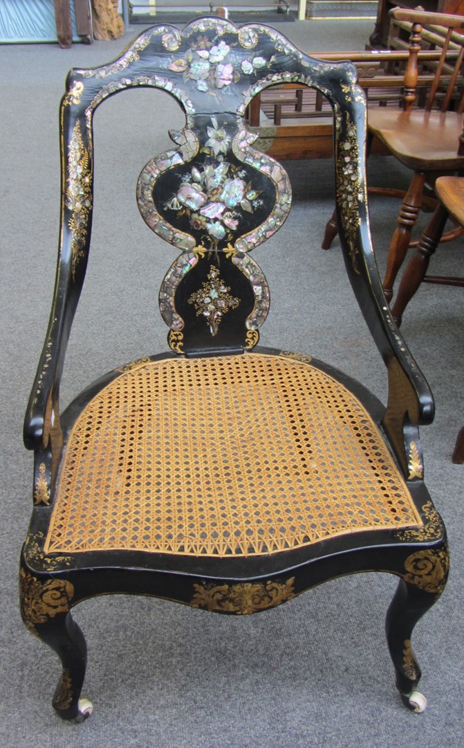 Appraisal: A Victorian mother of pearl inlaid papier mache open armchair