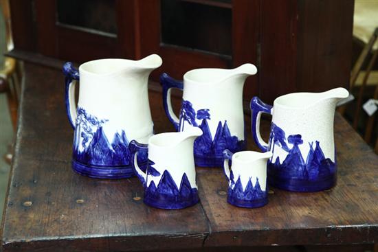 Appraisal: GRADUATED SET OLD SLEEPY EYE PITCHERS Five pitchers with cobalt