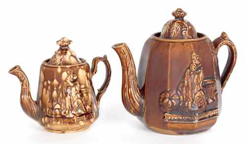 Appraisal: Two Rockingham glaze teapots th c depicting Rebecca at the