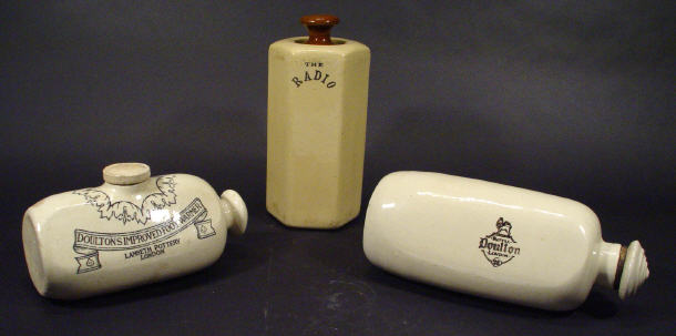 Appraisal: Three stoneware foot warmers two by Royal Doulton the other