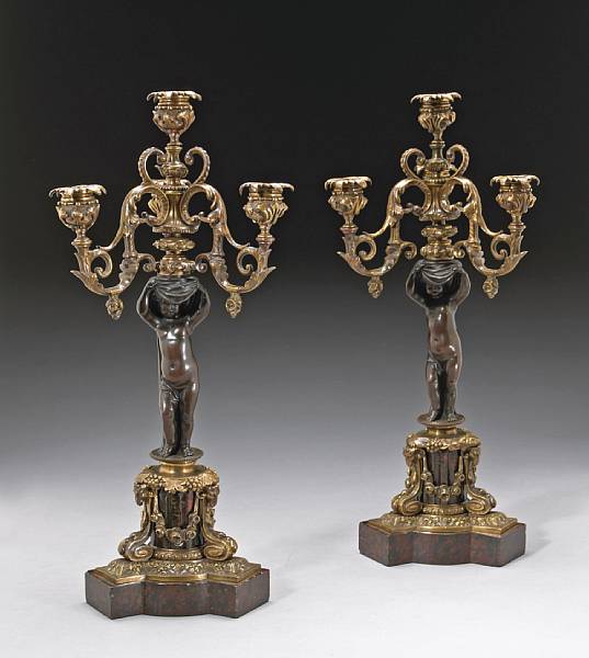 Appraisal: A pair of English bronze and rouge marble figural four