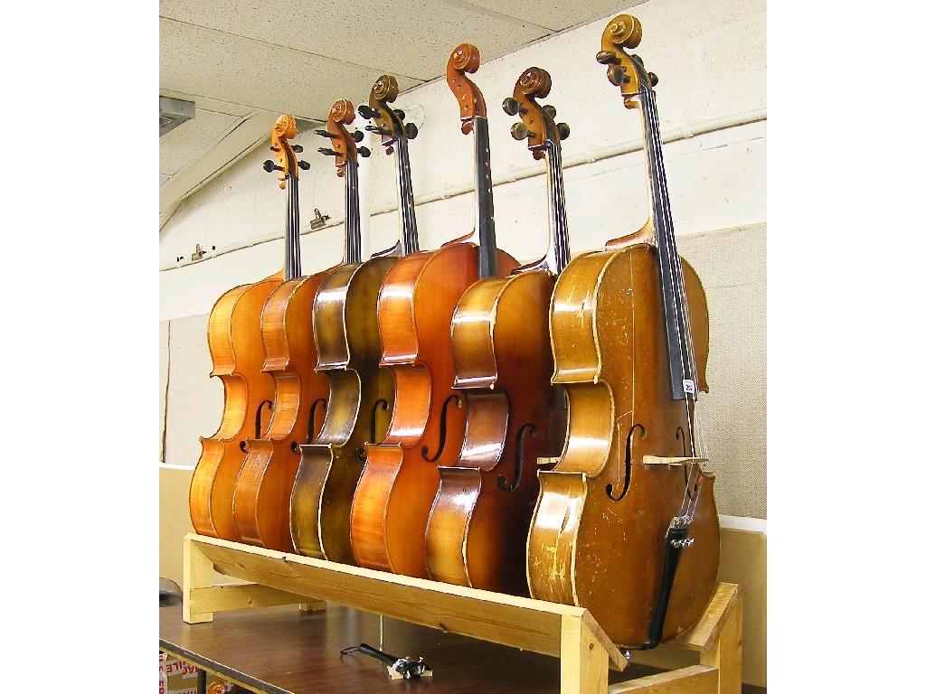 Appraisal: Four full size contemporary student grade violoncellos together with a