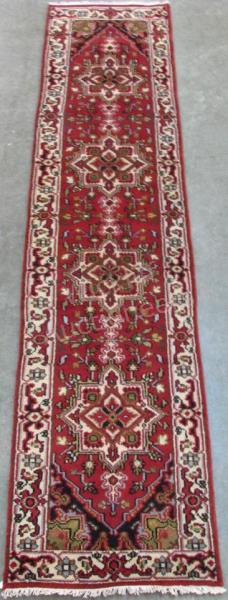 Appraisal: Handmade Oriental Runner Heriz design burgundy field with cream and