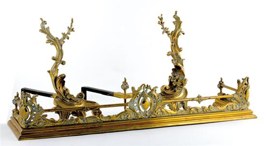 Appraisal: French style brass andirons and fire fender Louis XV style