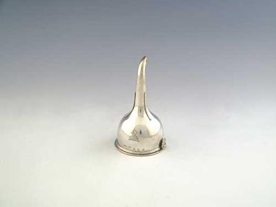 Appraisal: A George III Irish wine funnel plain with a lift