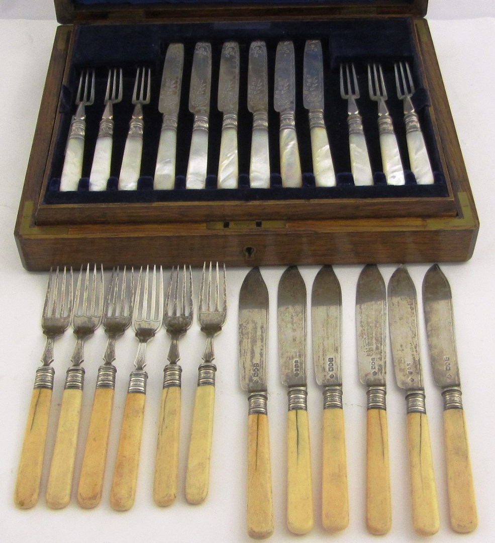 Appraisal: Twelve pairs of silver dessert or fruit knives or forks