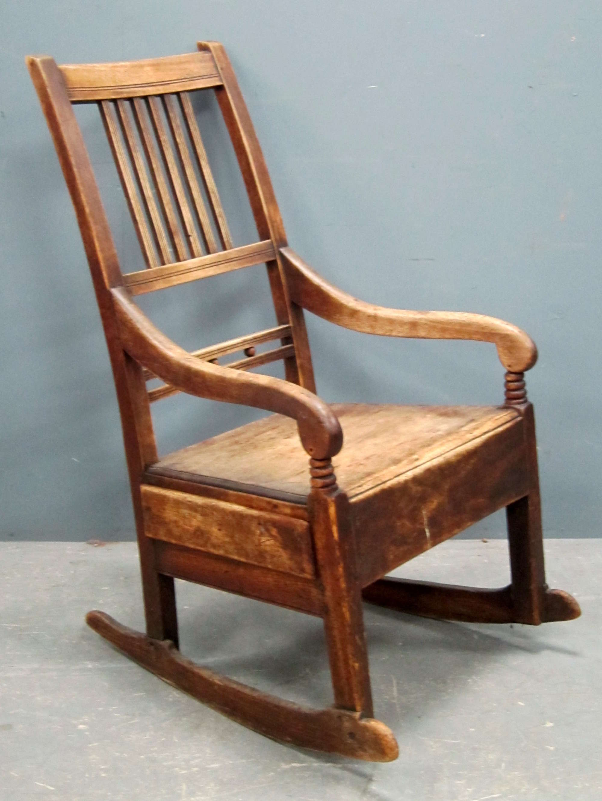 Appraisal: Mahogany framed rocking chair with single drawer to one side