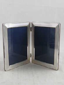 Appraisal: A silver double picture frame picture size x cm