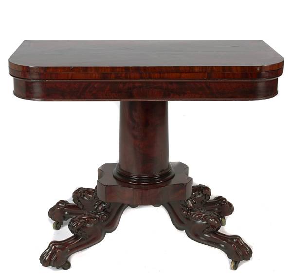 Appraisal: An American Classical mahogany games table on paw feet height