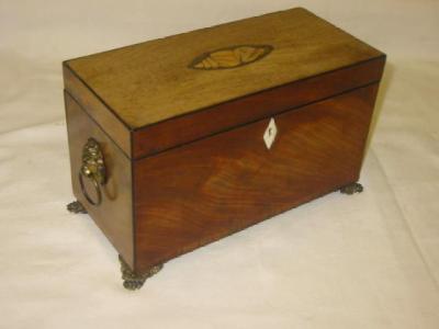 Appraisal: A GEORGE III MAHOGANY TEA CADDY of oblong form with