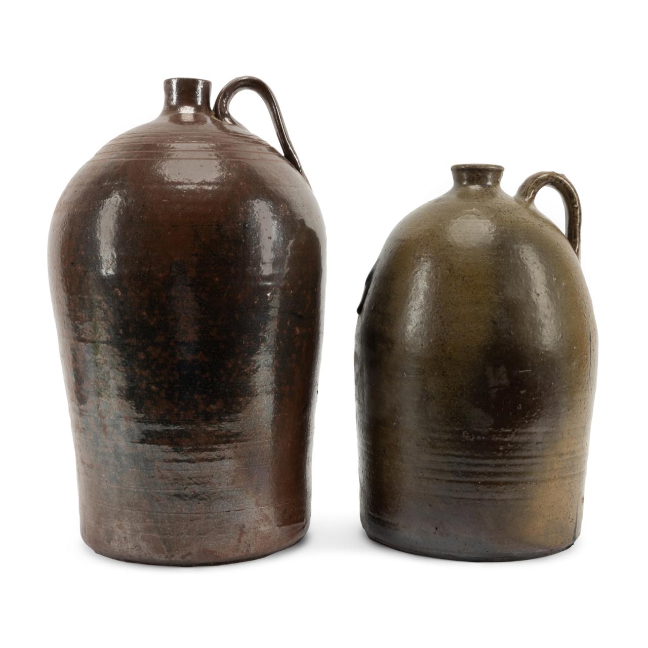 Appraisal: TWO AMERICAN BROWN GREEN GLAZED POTTERY JUGS Group of two