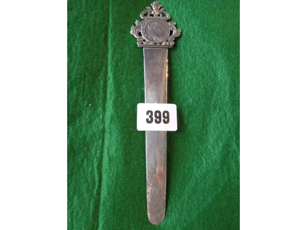 Appraisal: A silver letter opener with scrolled crest with a William