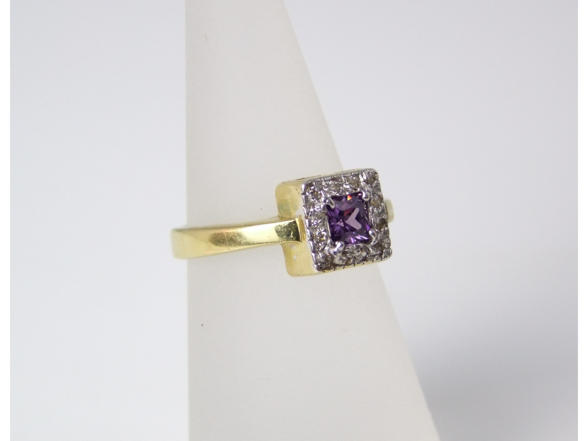 Appraisal: An ct gold amethyst and diamond cluster ring