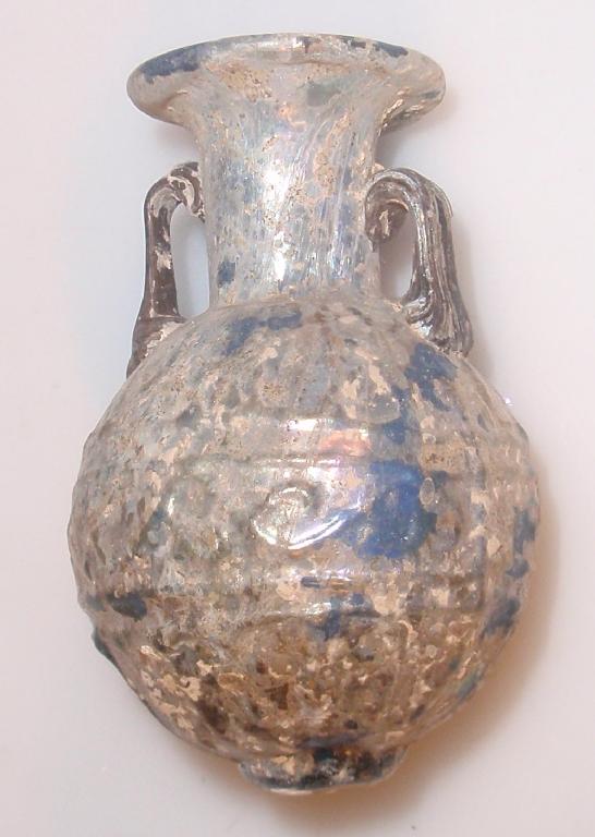 Appraisal: A pale green mould-blown two-handled 'Sidonian' glass amphoriskos the everted