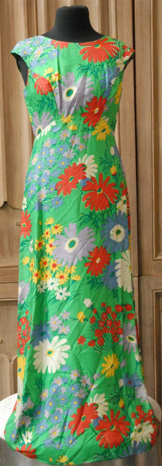 Appraisal: GREEN FULL LENGTH SILK DRESS Bright contrasting florals sizes avarage