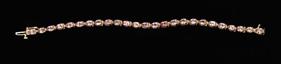 Appraisal: K YELLOW GOLD AND RUSSIAN RASPBERRY SPINEL TENNIS BRACELET Bracelet