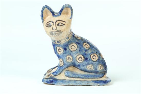 Appraisal: DECORATED CAT Chinese th century earthenware Seated cat with cobalt