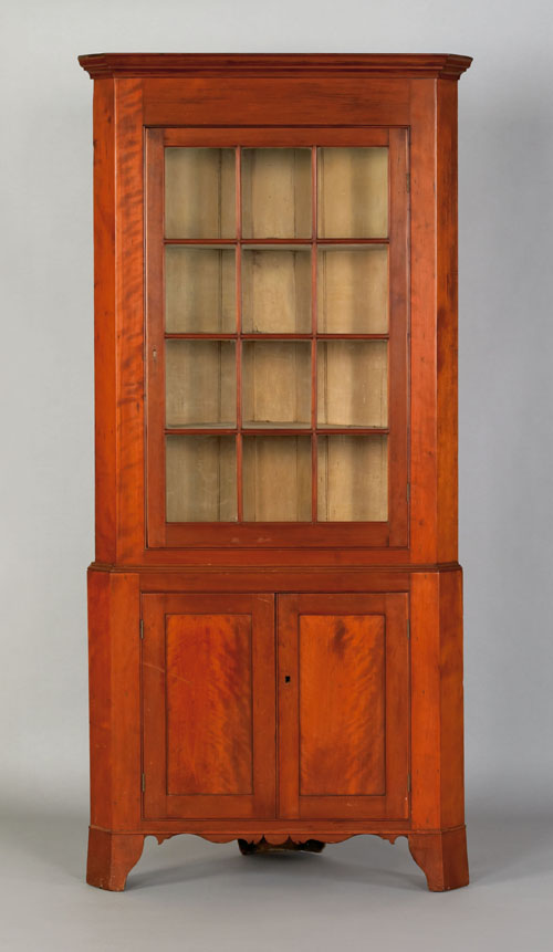 Appraisal: Pennsylvania Federal two part cherry corner cupboard early th c