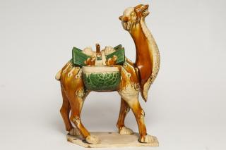 Appraisal: Chinese Sancai Glazed Earthenware Camel Chinese sancai glazed earthenware pottery