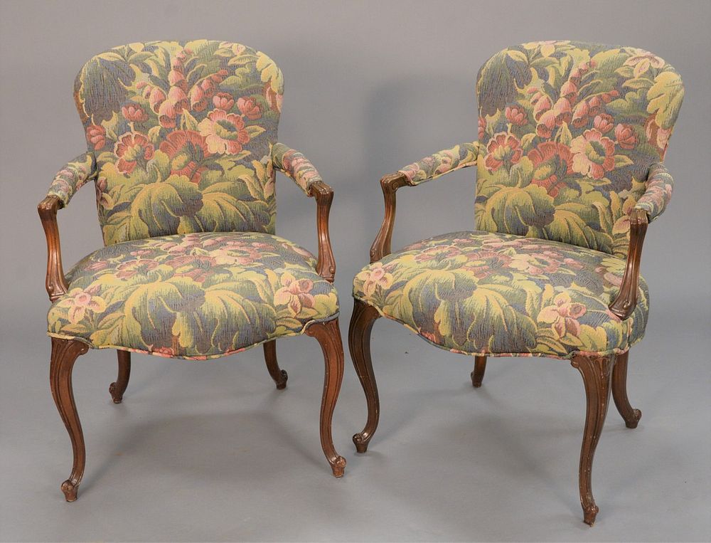 Appraisal: Pair of Louis XV-style upholstered armchairs Regency Decorators tag on