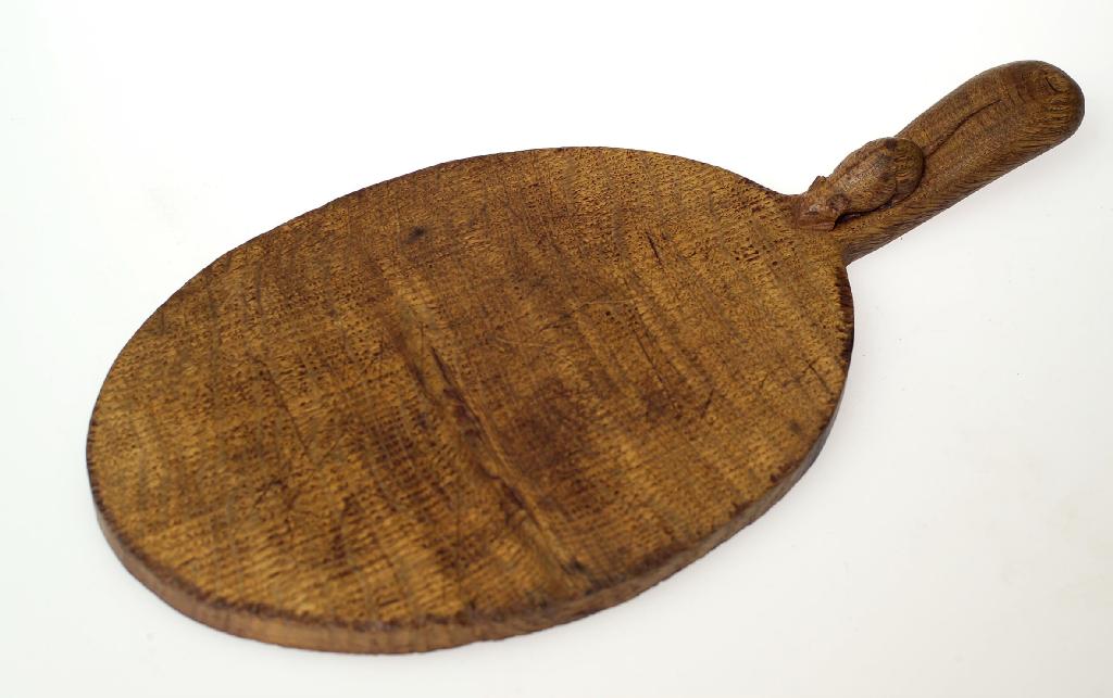 Appraisal: ROBERT MOUSEMAN THOMPSON OAK CHEESE BOARD of oval form with