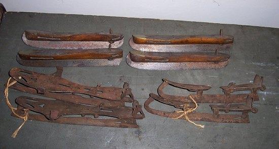 Appraisal: A pair of wooden and brass mounted ice skates the