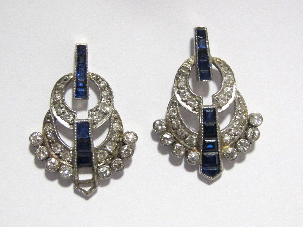 Appraisal: A pair of Art Deco white metal sapphire and diamond