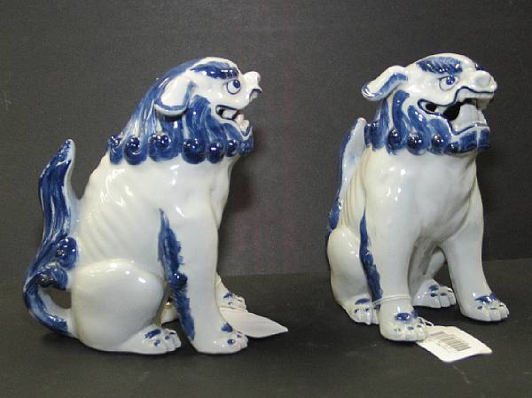 Appraisal: A pair of Kutani blue and white porcelain lion dogs