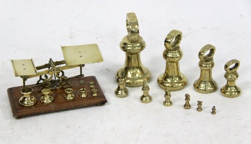 Appraisal: A brass and mahogany set of postal scales with seven