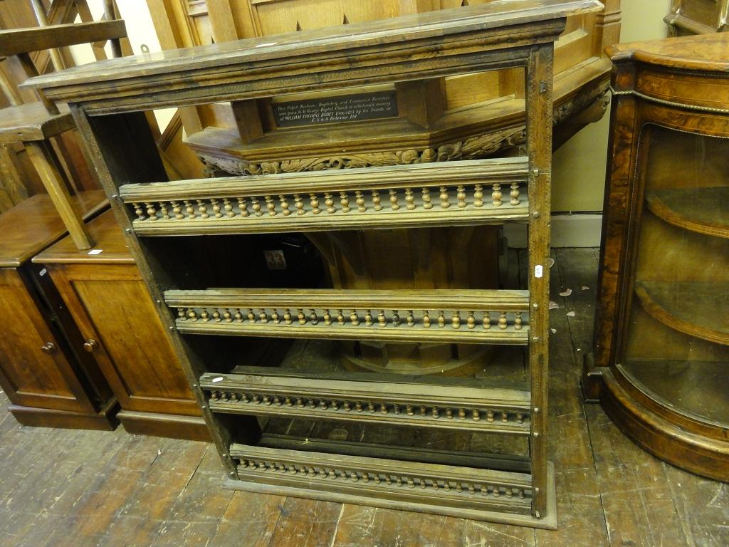 Appraisal: An antique Bretton oak four tier open plate rack with