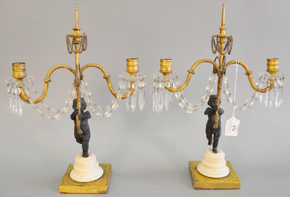 Appraisal: Pair of Louis XVI French candelabras having cherub support holding