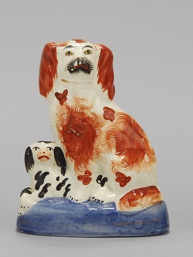 Appraisal: STAFFORDSHIRE FIGURE GROUP Circa Seated rust-red and white spaniel with