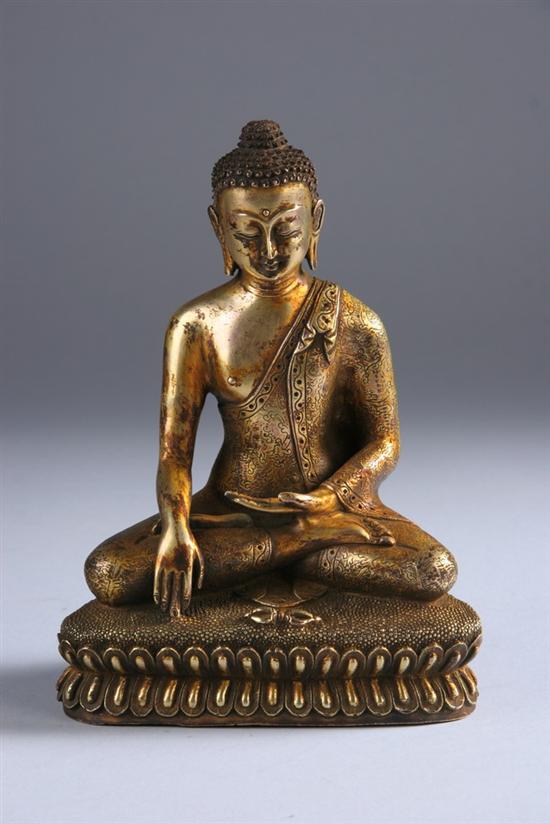 Appraisal: TIBETAN GILT FIGURE OF AKSHOBYA BUDDHA th- th century Seated