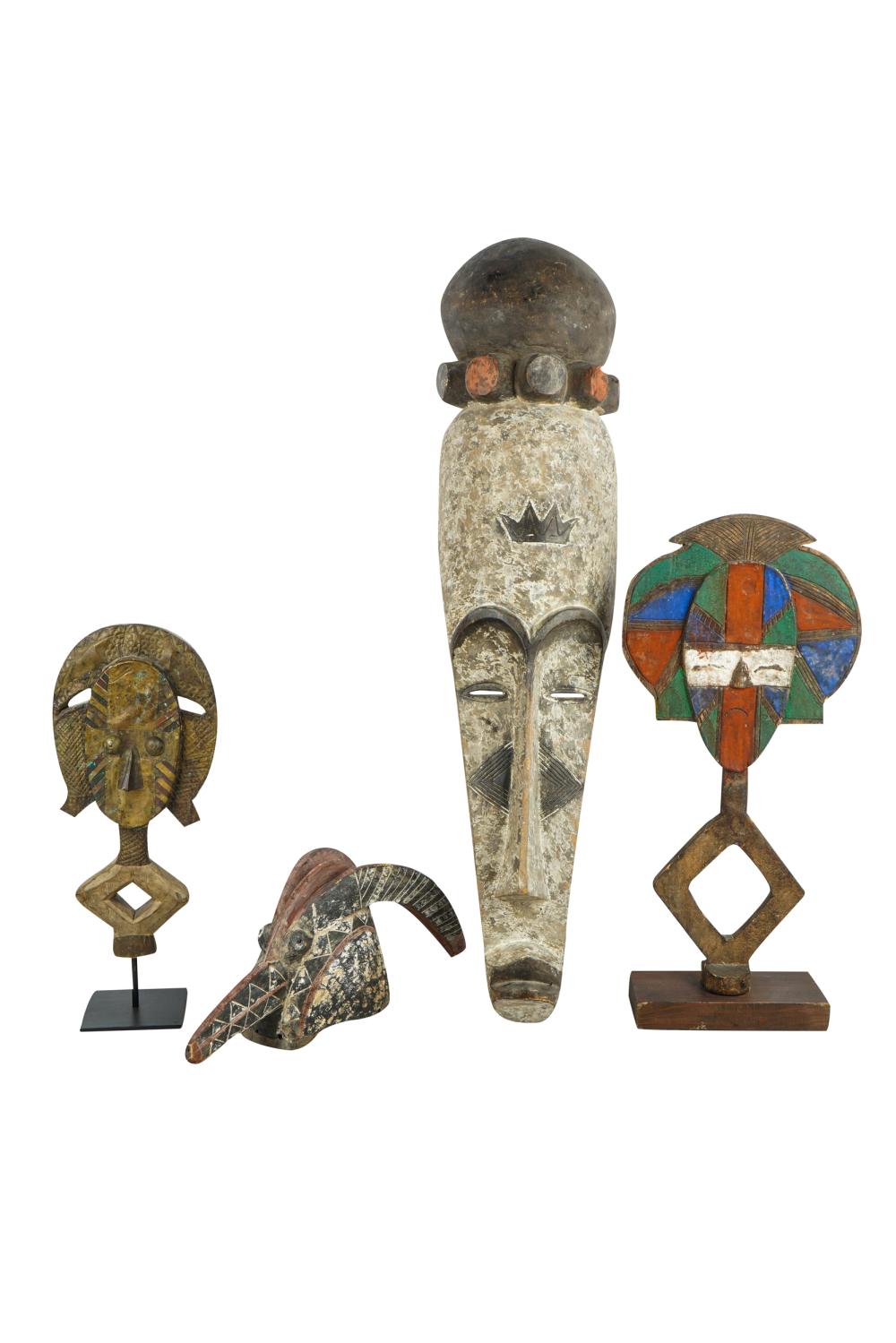 Appraisal: GROUP OF FOUR AFRICAN CARVINGScomprising two masks and two figures