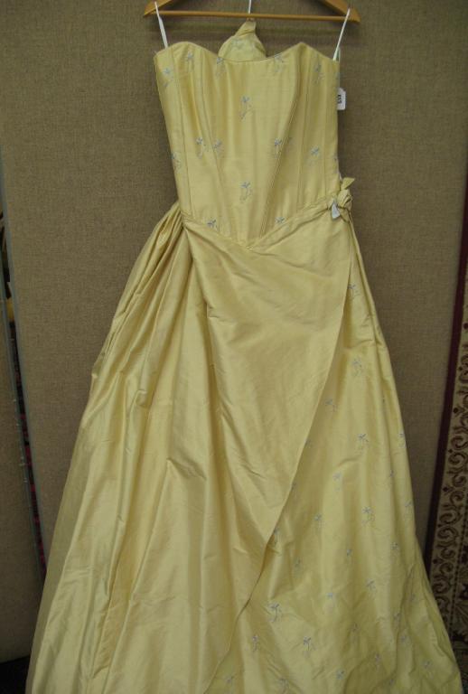 Appraisal: Dizzy Lizzie Couture a light gold coloured strapless wedding dress