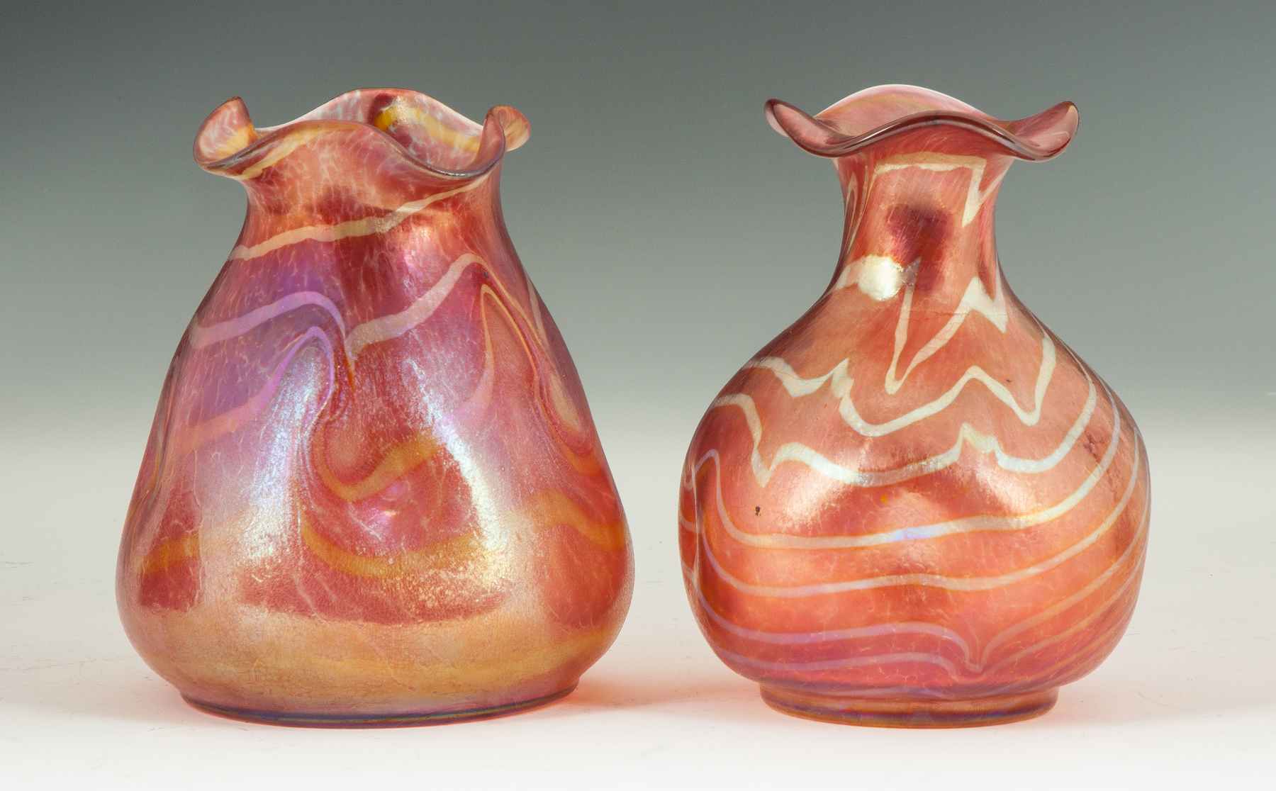 Appraisal: Two Loetz Style Decorated Red Vases Early th cent Both