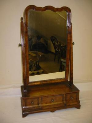 Appraisal: A WALNUT TOILET MIRROR of early Georgian design the arched