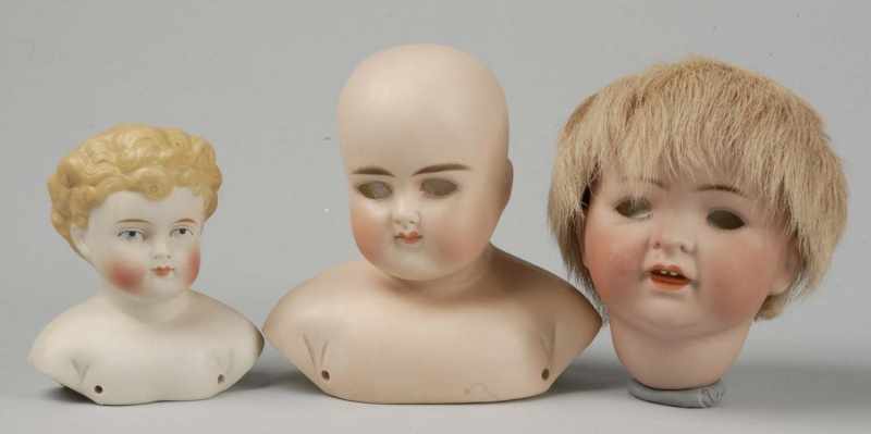 Appraisal: Lot of German Bisque Heads Description Cute G B George