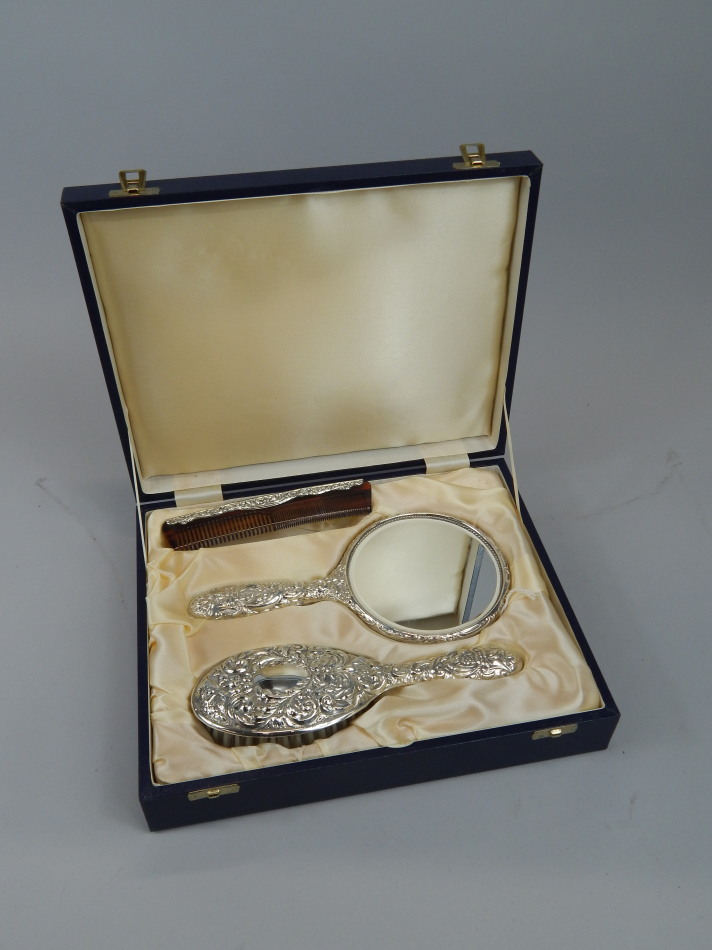 Appraisal: A modern silver dressing table set comprising hand mirror hand