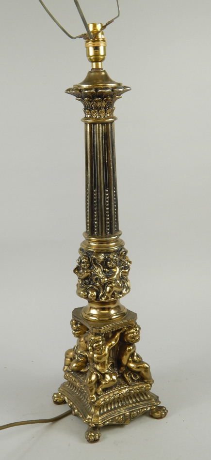 Appraisal: A modern brass lamp base decorated with putti etc cm