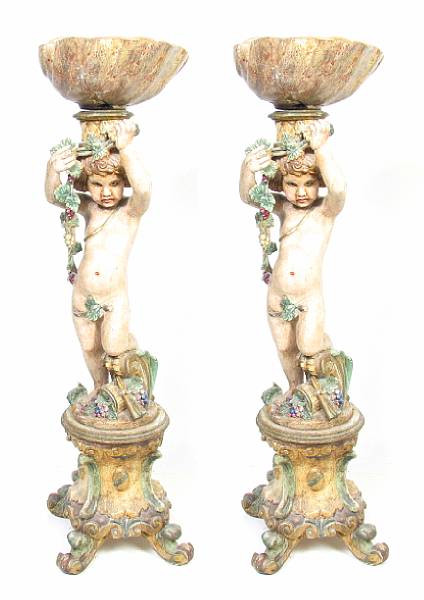 Appraisal: A pair of Italian Rococo style polychrome decorated figural jardinieres