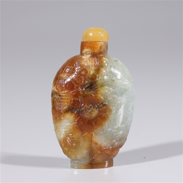 Appraisal: Chinese carved jadeite snuff bottle carved floral designs dark rust