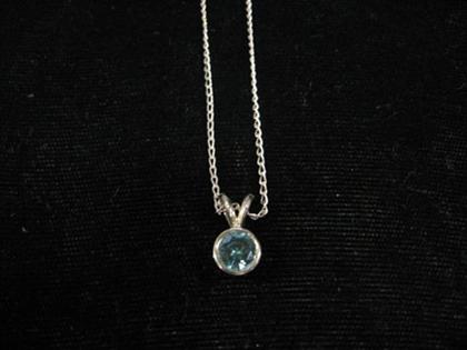 Appraisal: Unusual blue diamond pendant Color treated round brilliant diamond bezel