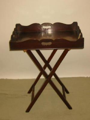 Appraisal: A MAHOGANY BUTLERS TRAY on stand the tray of oblong