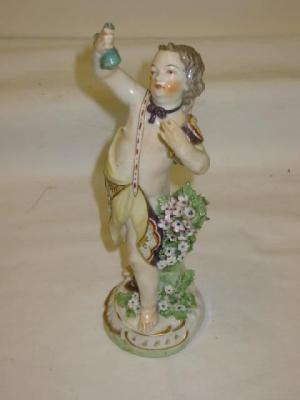 Appraisal: A CHELSEA DERBY PORCELAIN FIGURE modelled as a cherub holding